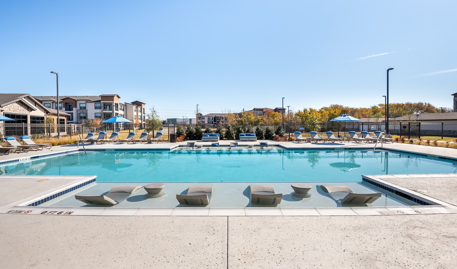 a swimming pool in front of a building