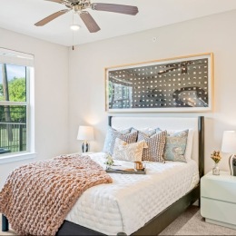 Bedroom with natural lighting and high ceilings