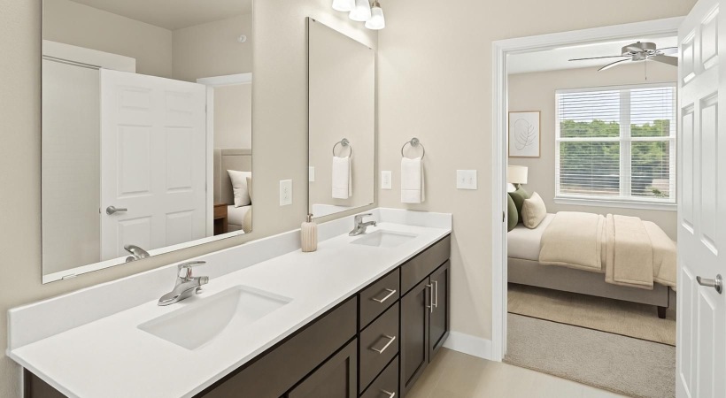 a bathroom with sinks and a mirror
