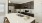 a kitchen with dark wood cabinets