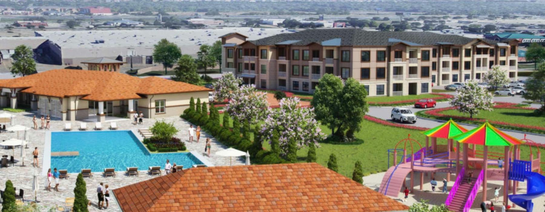 a large building with a pool and playground in front of it
